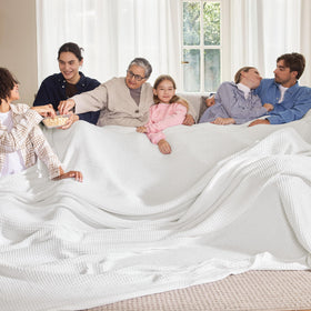 Bedsure Gentlesoft blanket on an oversized king bed highlights breathable cotton comfort.