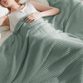 Bedsure Gentlesoft blanket on bed highlights sage green color and soft drape for relaxing evenings