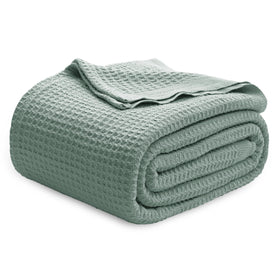 Bedsure Gentlesoft blanket closeup weave in sage green shows breathable cotton texture for cool nights