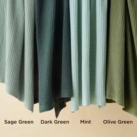 Bedsure Gentlesoft blanket draped on bed shows lightweight warmth and cozy style