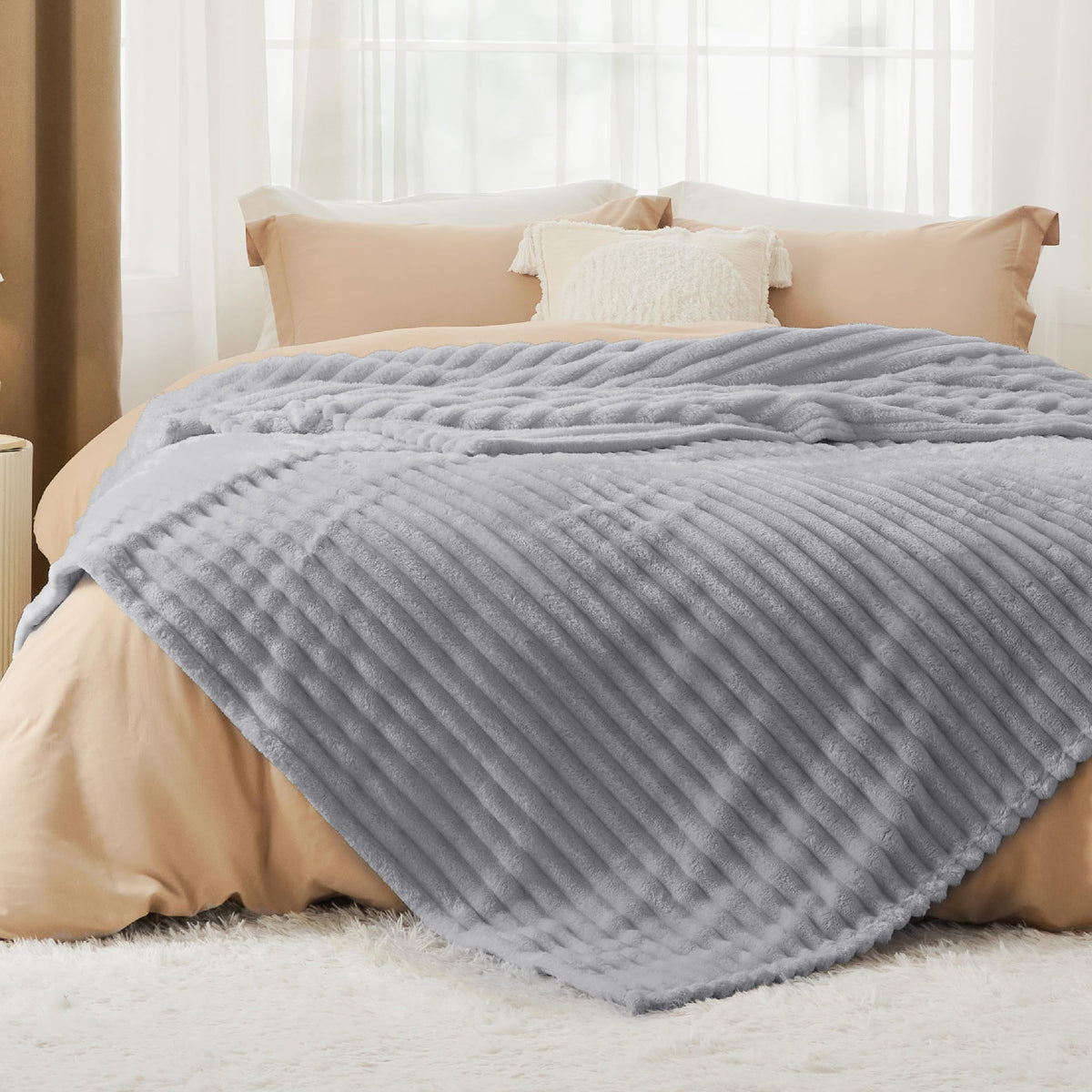 Bedsure GentleSoft blanket on bed showing plush microfiber for year-round comfort