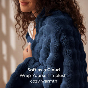 Bedsure GentleSoft blue bubble blanket drapes over a sofa with all season warmth.