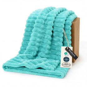 Bedsure GentleSoft Blue Fog fleece blanket on couch for cozy evenings
