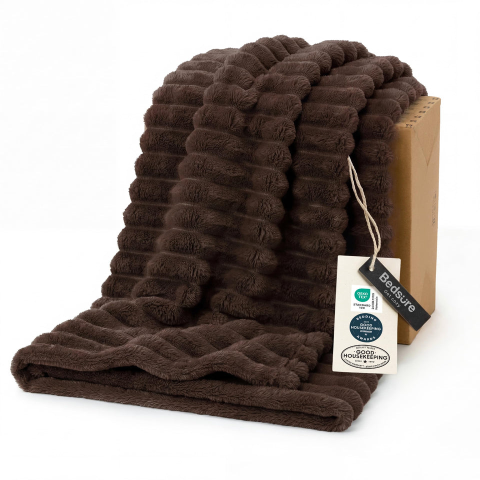 Bedsure GentleSoft chocolate brown throw on couch for cozy evenings.