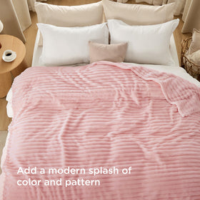 Bedsure GentleSoft coral pink blanket on bed for snug sleep vibes