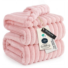 Bedsure GentleSoft coral pink fleece blanket on couch for cozy movie nights