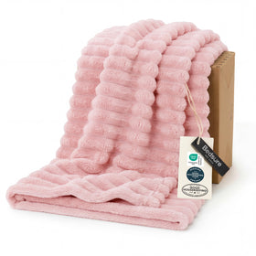 Bedsure GentleSoft coral pink fleece closeup shows ultra-soft texture for cozy nights.
