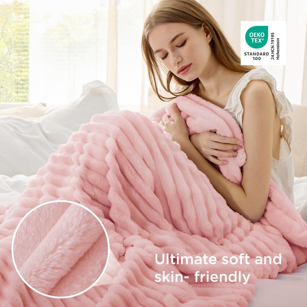 Bedsure GentleSoft coral pink fleece twin blanket on bed for lightweight warmth.