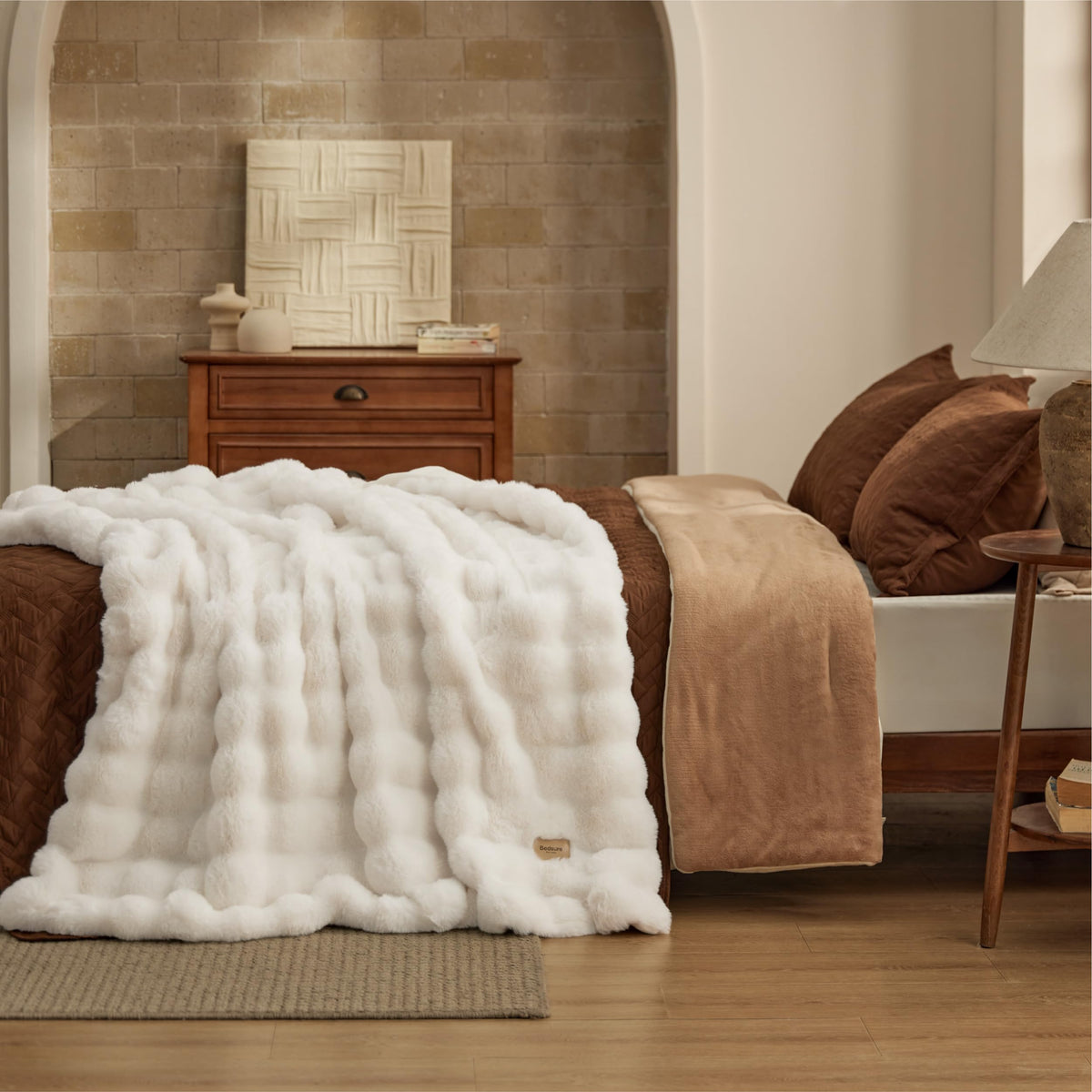 Bedsure GentleSoft cream throw on couch as decorative layer.