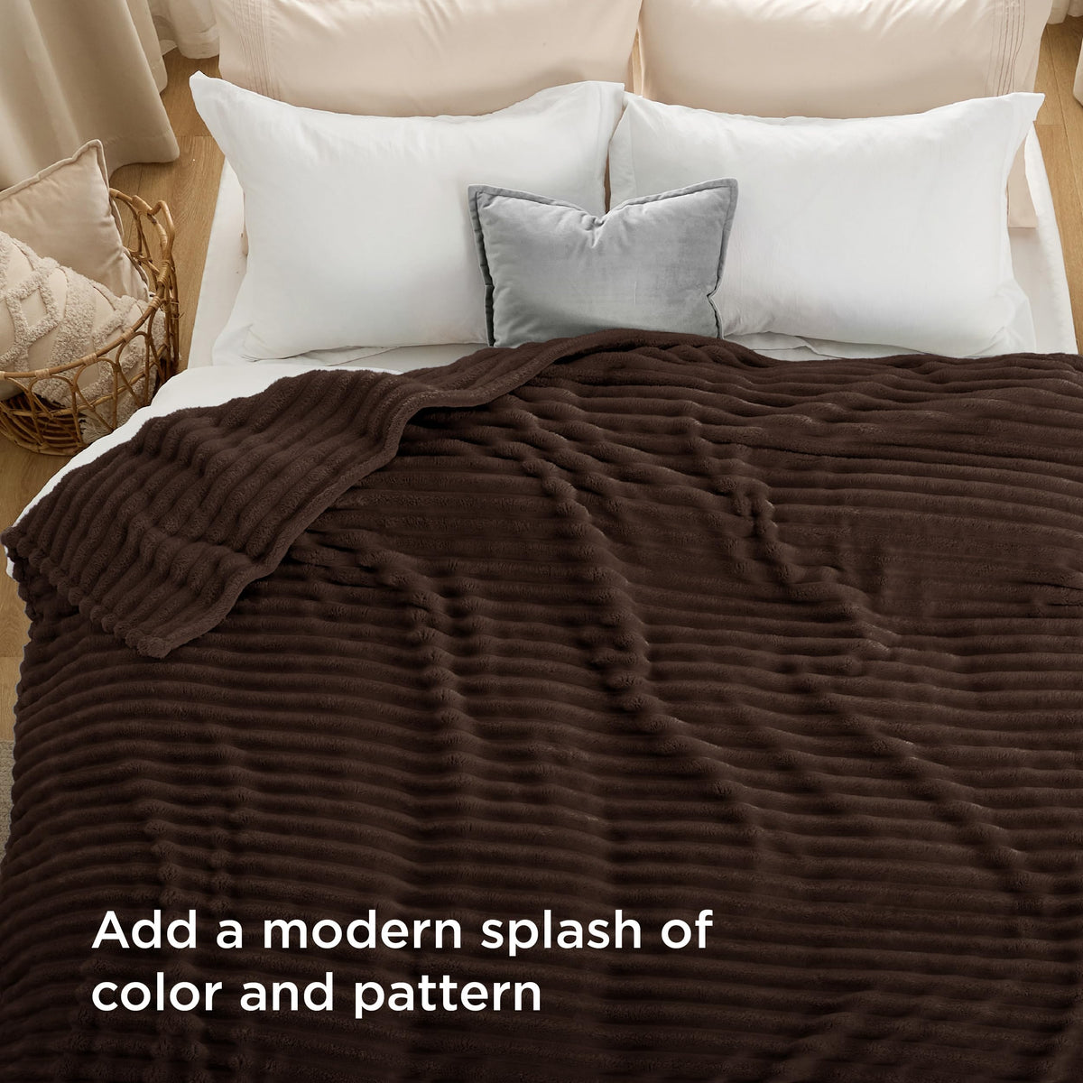 Bedsure GentleSoft blanket folded on bed showcasing rich chocolate shade and stripe pattern