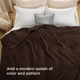 Bedsure GentleSoft blanket folded on bed showcasing rich chocolate shade and stripe pattern