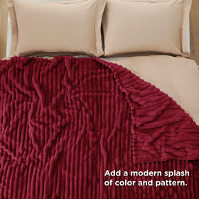 Bedsure GentleSoft Deep Red Blanket closeup stripe texture highlights design.