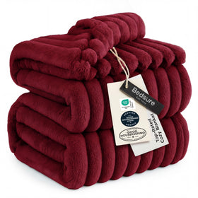 Bedsure GentleSoft Deep Red Blanket on couch adds cozy warmth for relaxing evenings.