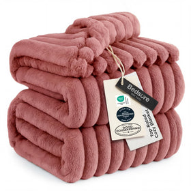 Bedsure GentleSoft dusty pink blanket on a couch adds cozy warmth