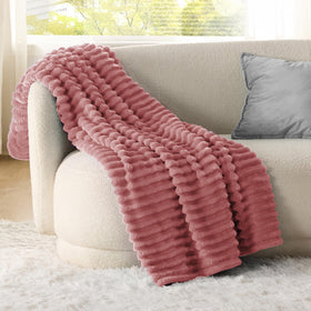 Closeup of Bedsure GentleSoft dusty pink fleece texture showing plush microfiber.