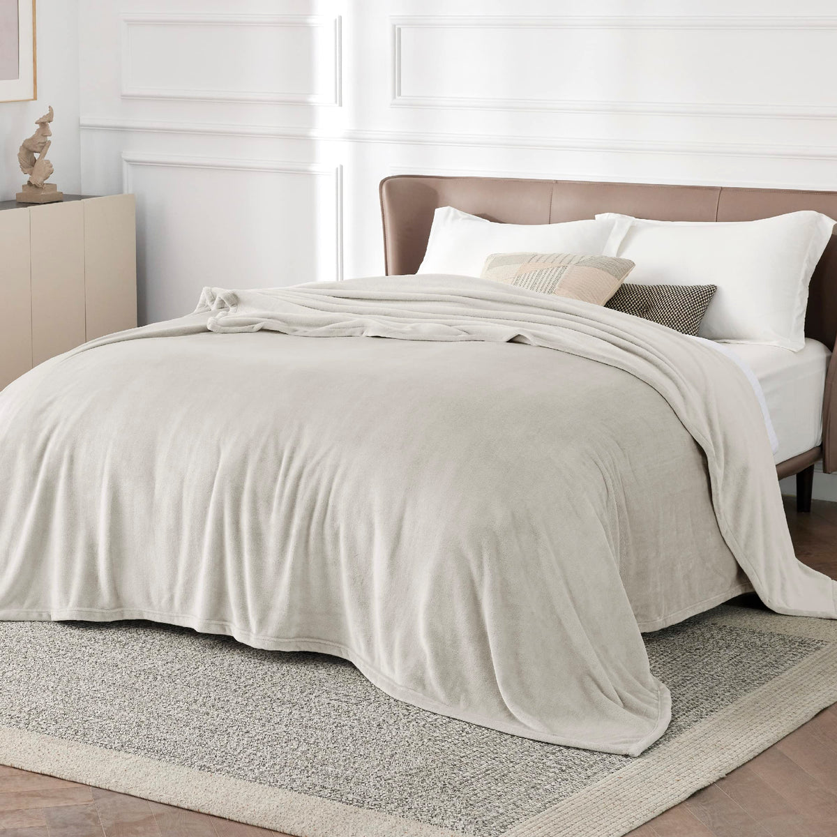 Bedsure GentleSoft fleece blanket laid on a bed in California king size