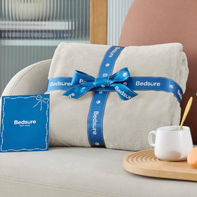 Bedsure GentleSoft fleece blanket outdoors for camping or car trips.