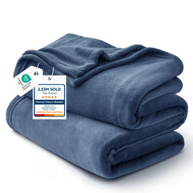 Bedsure GentleSoft fleece blanket on bed in mineral blue for cozy warmth