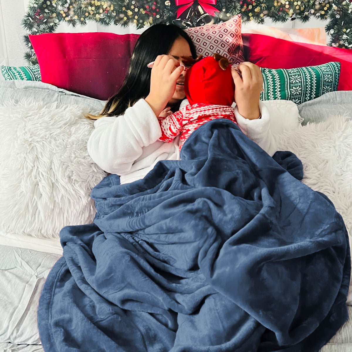 Bedsure GentleSoft fleece blanket Mineral Blue on sofa for relaxed evenings.