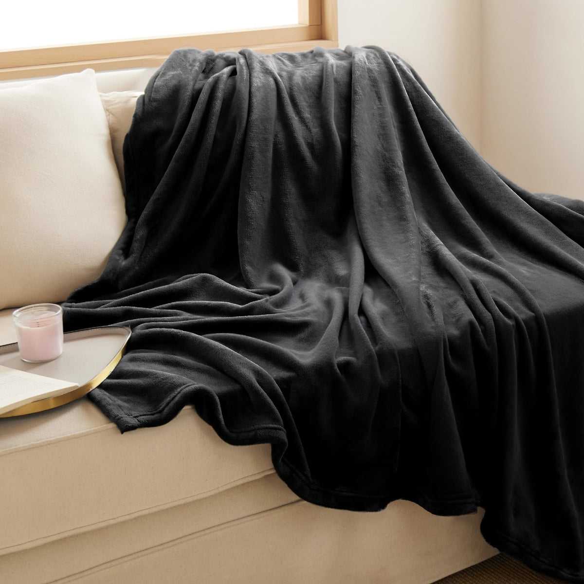 Bedsure GentleSoft fleece blanket placed on a sofa adding cozy decor and warmth