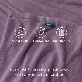 Bedsure GentleSoft fog purple blanket draped on bed adds inviting color and texture.