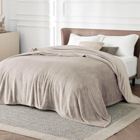 Bedsure GentleSoft fleece blanket folded, showing plush thickness and Oxford Tan shade, ready for gifting.