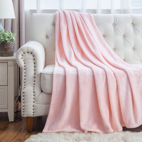 Bedsure GentleSoft pink throw serves as a color-rich bedroom accent.