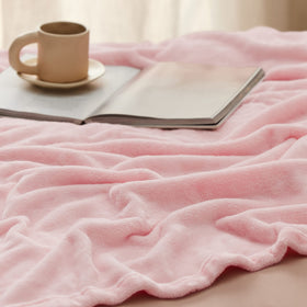 Bedsure GentleSoft blanket draped over sofa for lounging comfort
