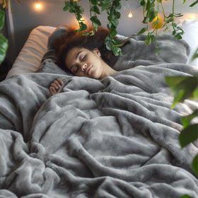 Bedsure GentleSoft blanket on California King bed in grey for year-round comfort