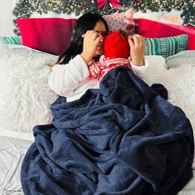 Bedsure GentleSoft fleece throw 50x70 inches folded to showcase size.