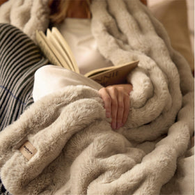 Bedsure GentleSoft draped over sofa invites relaxed lounging and comfort.