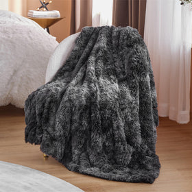 Bedsure GentleSoft fluffy blanket on bed adds warmth and style to bedding.