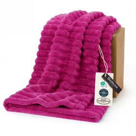 Bedsure GentleSoft hot pink throw on couch for cozy evenings.