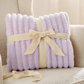 Bedsure GentleSoft Lavender Fog Throw rolled beside lamp adds calming decor touch