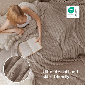 Bedsure GentleSoft blanket draped on bed for warm snuggling.
