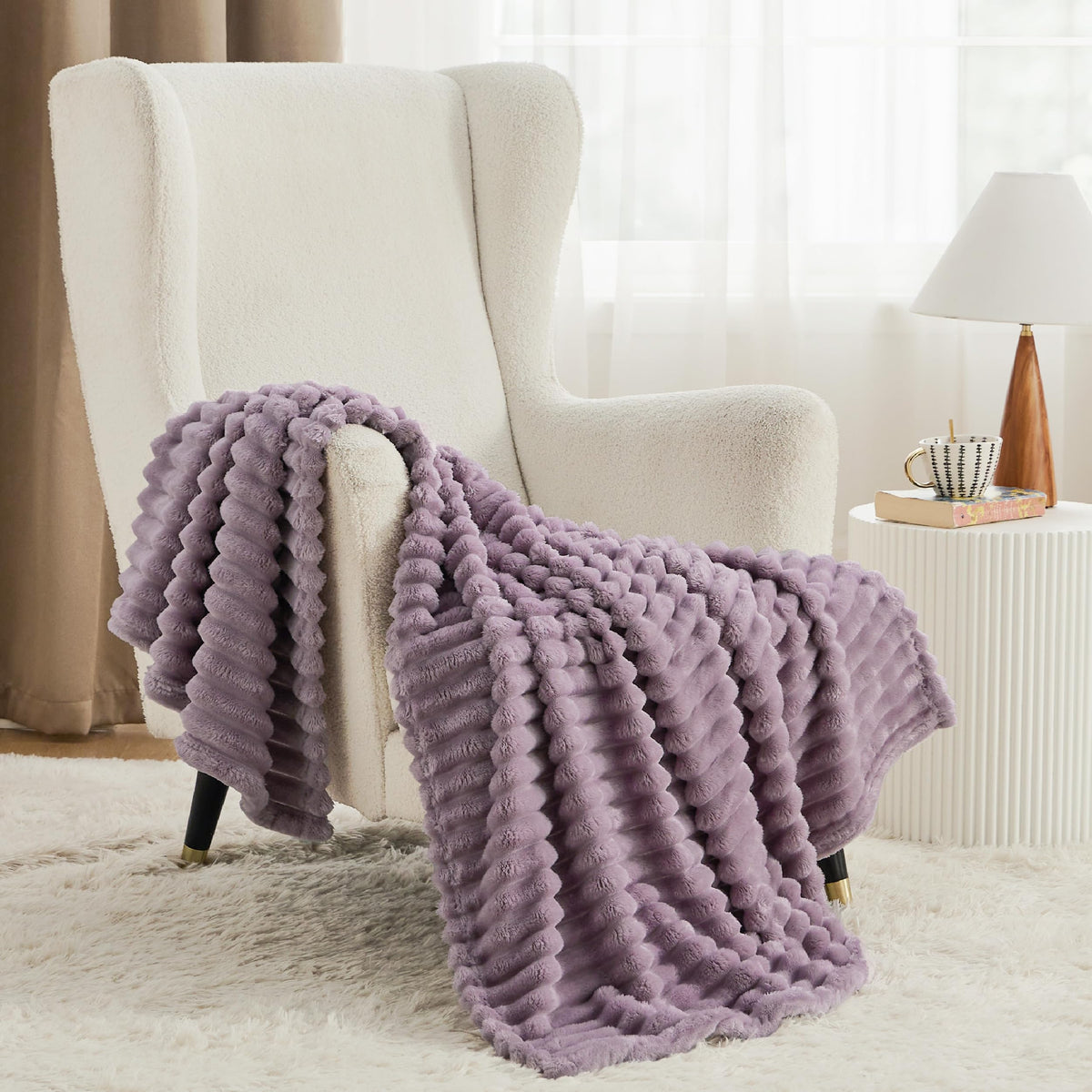 Bedsure GentleSoft light purple throw on bed creates inviting, relaxed ambiance.
