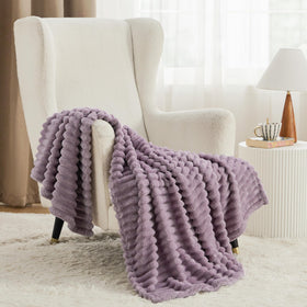 Bedsure GentleSoft light purple throw on bed creates inviting, relaxed ambiance.