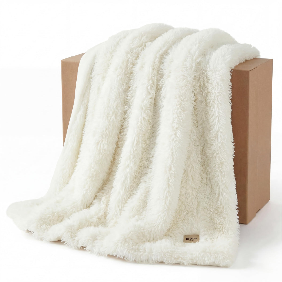 Bedsure GentleSoft luxury faux fur throw, front view, enhances a cozy living room.