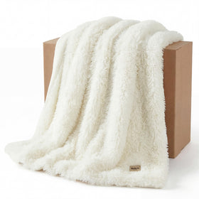 Bedsure GentleSoft luxury faux fur throw, front view, enhances a cozy living room.