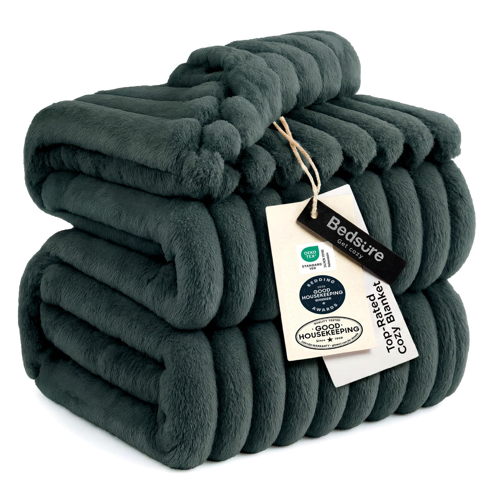 Bedsure GentleSoft Mallard Green blanket on a couch for cozy evenings.