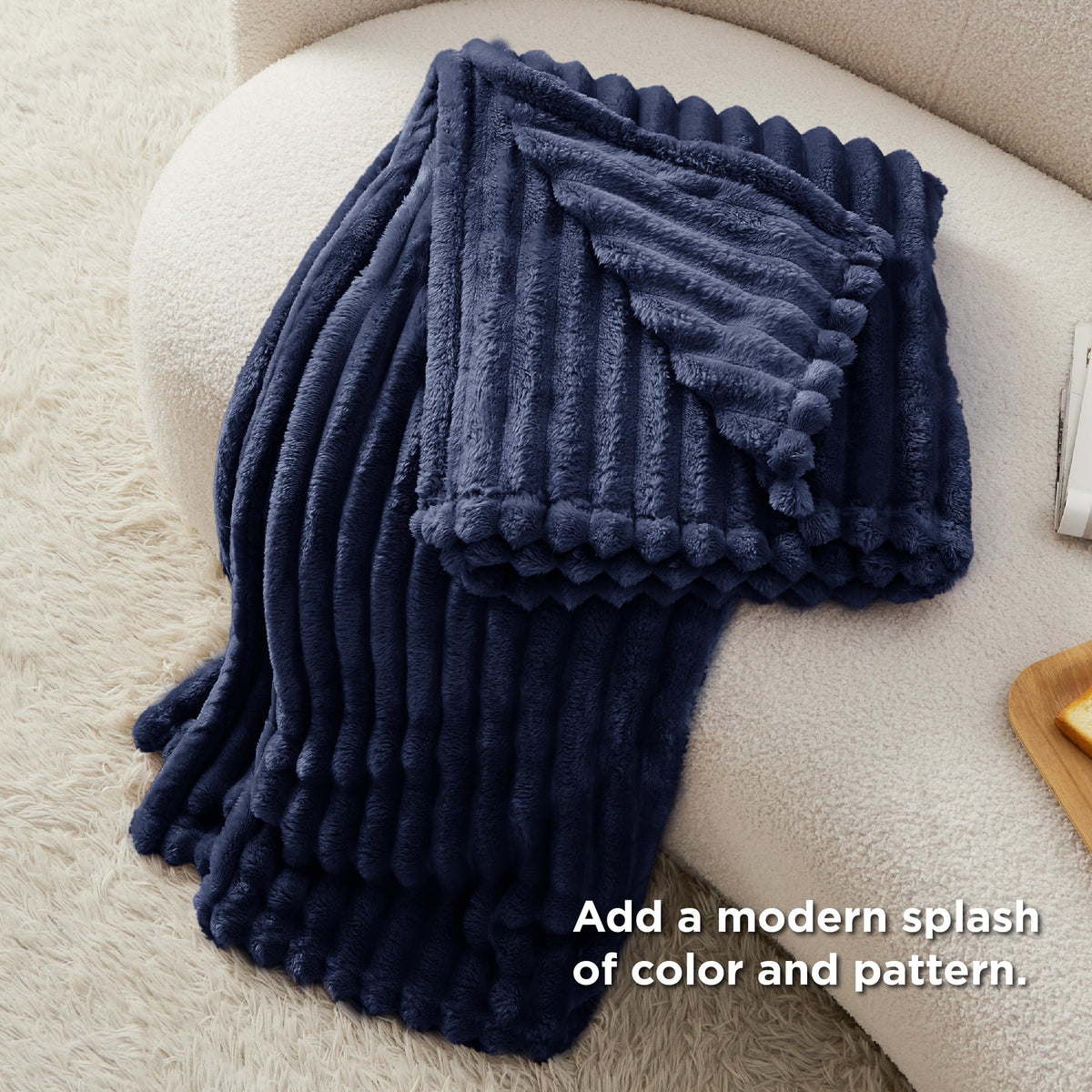 Bedsure GentleSoft navy-blue blanket soft fleece close-up emphasizes plush feel.