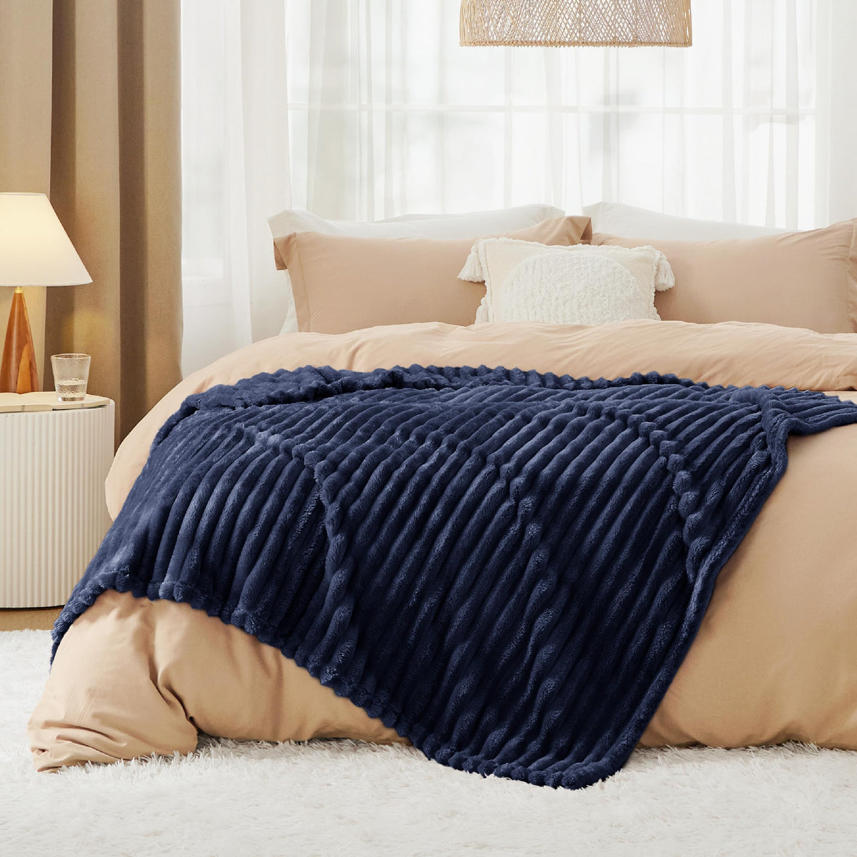 Bedsure GentleSoft navy blue fleece blanket being machine washed for easy care