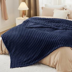 Bedsure GentleSoft navy fleece blanket being machine washed at home.