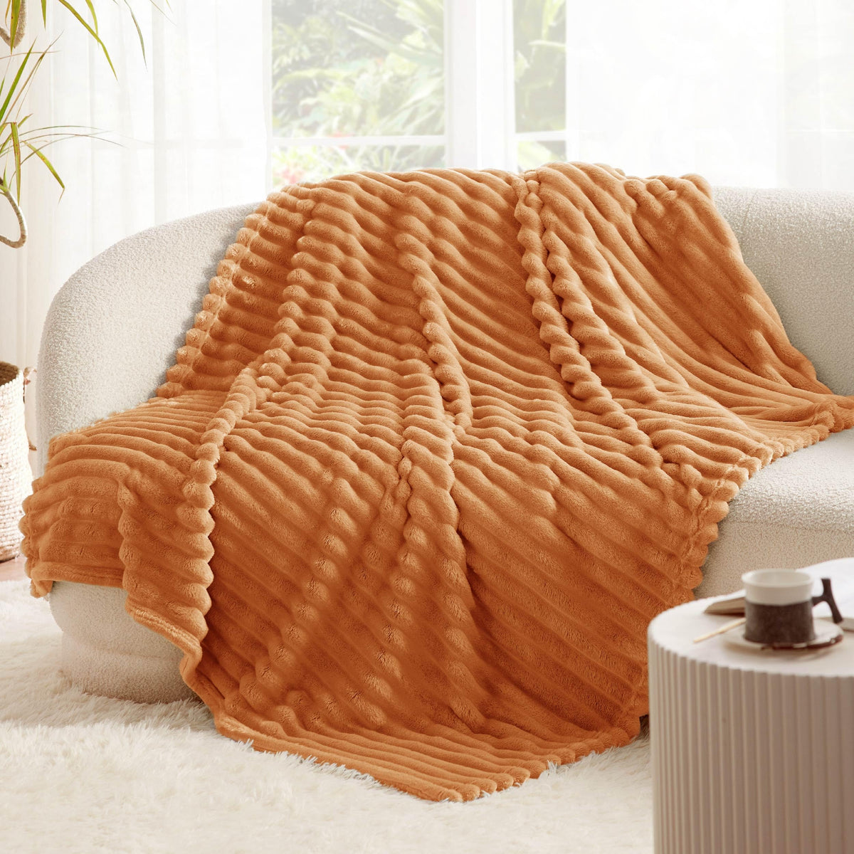 Bedsure GentleSoft orange fall throw blanket travel-ready for comfort anywhere.