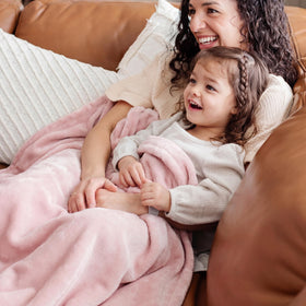 Bedsure GentleSoft pink blanket doubles as a couch cover with warmth