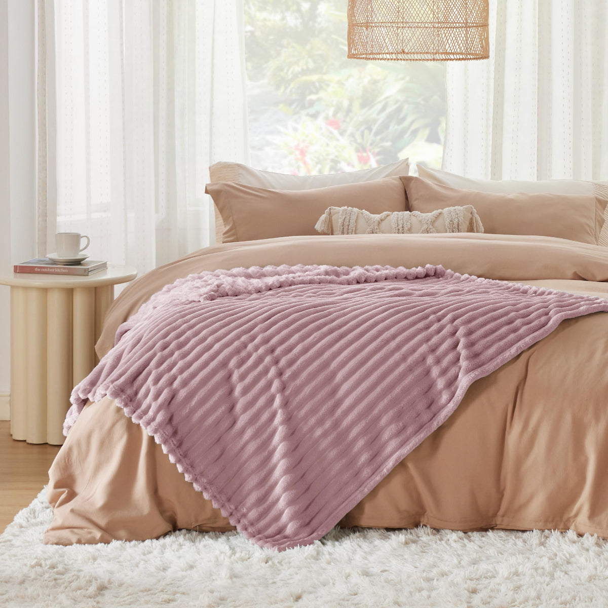 Bedsure GentleSoft pink fleece blanket in kids room adds charm