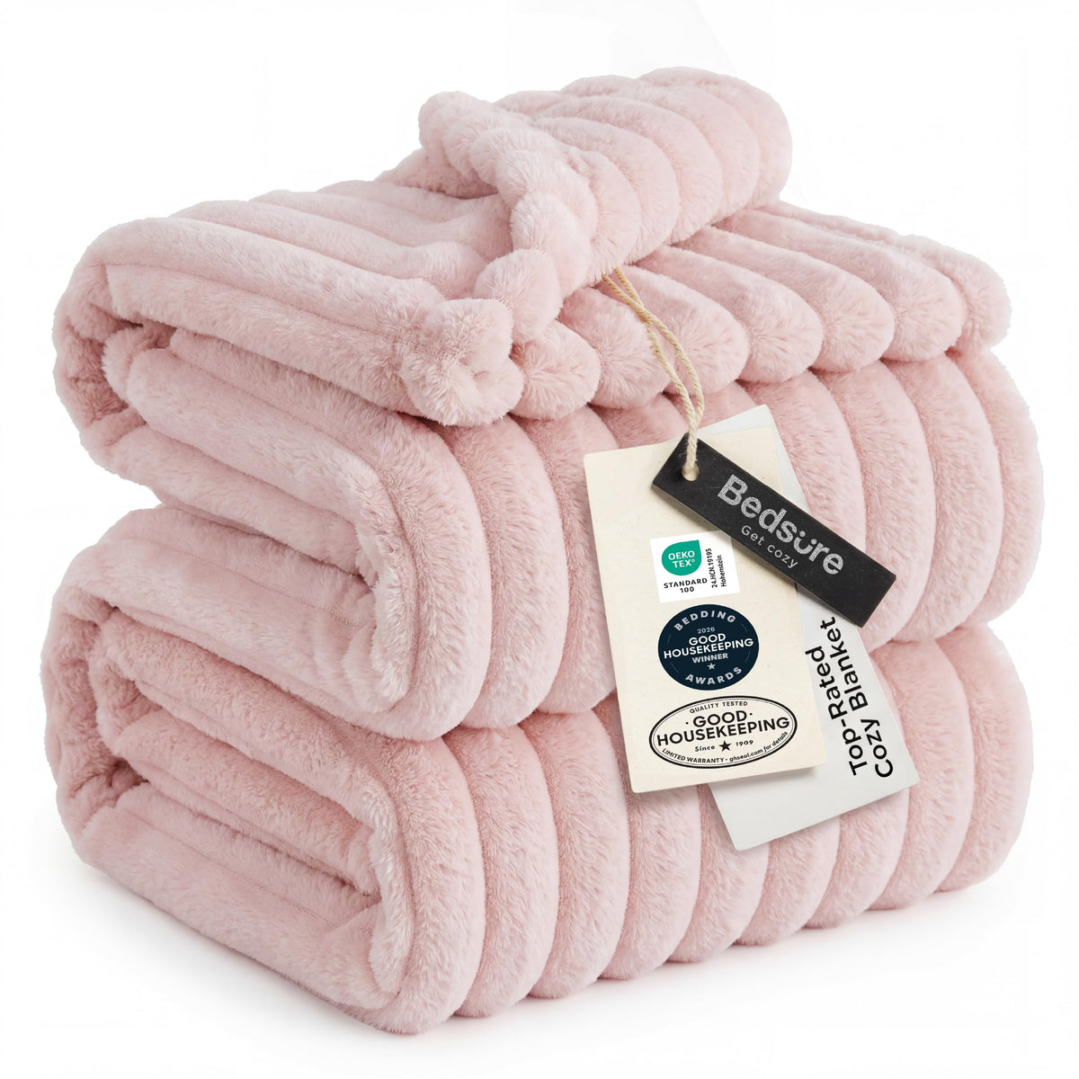 Bedsure GentleSoft Pink Throw on sofa provides cozy warmth for relaxing evenings.