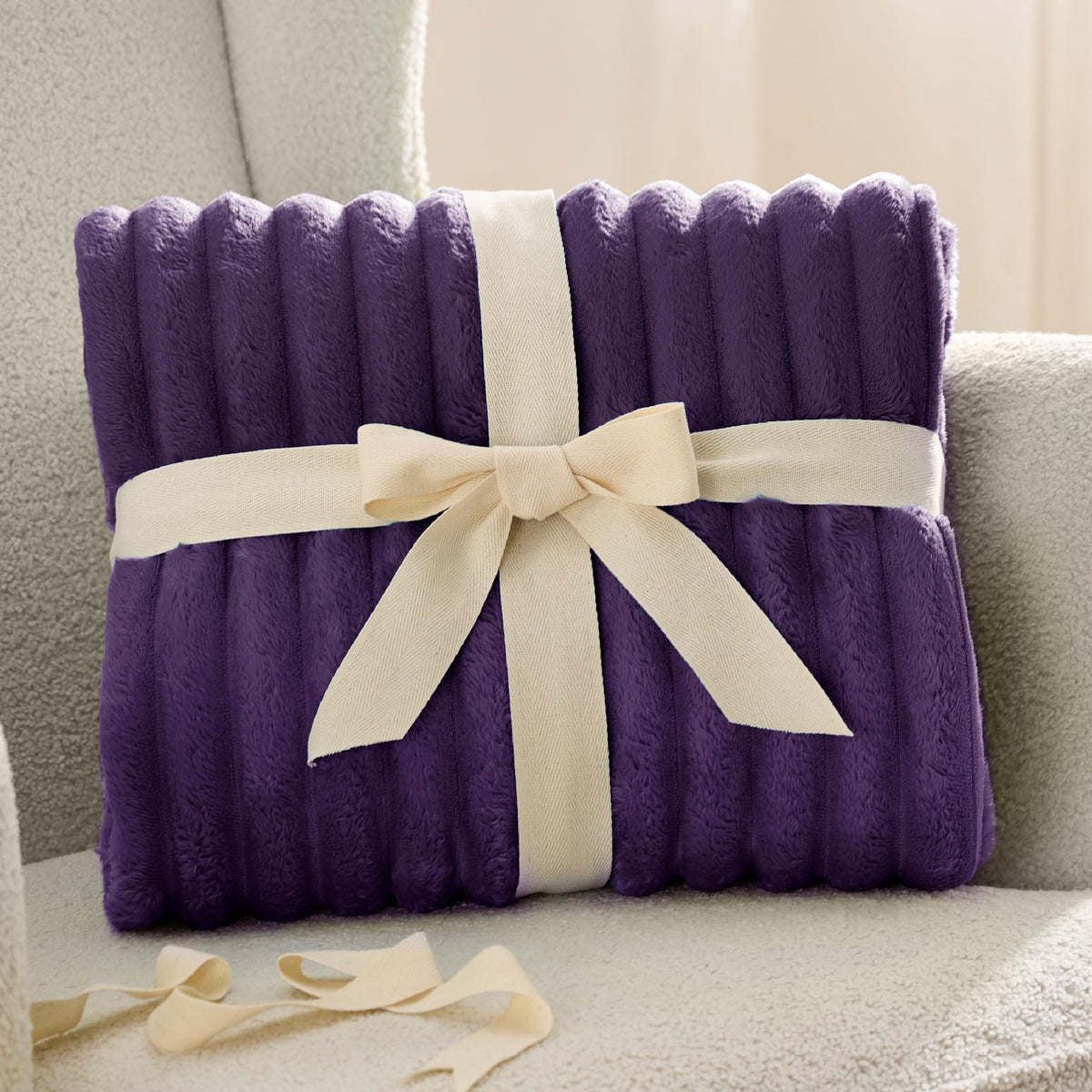 Bedsure GentleSoft purple fleece blanket being machine washed for easy care