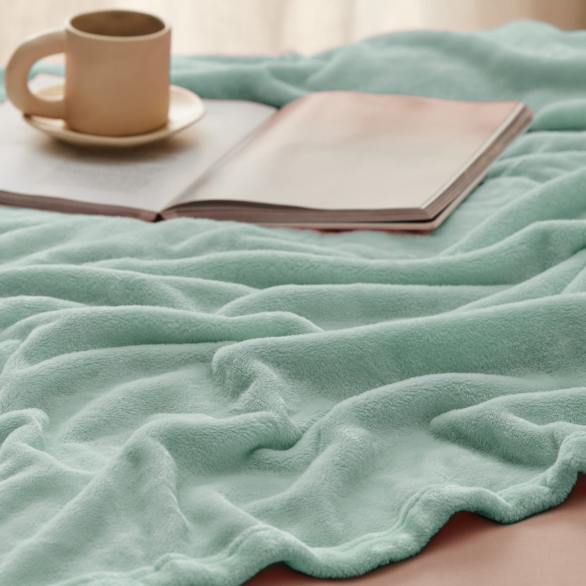 Bedsure GentleSoft sage green blanket folded for compact, easy storage.