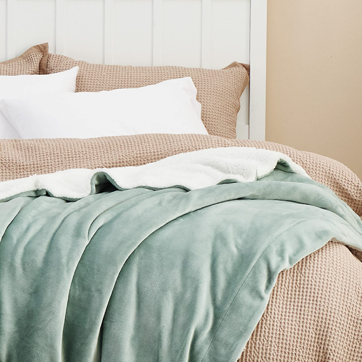 Bedsure GentleSoft sherpa blanket styled in a bedroom for soft decor.
